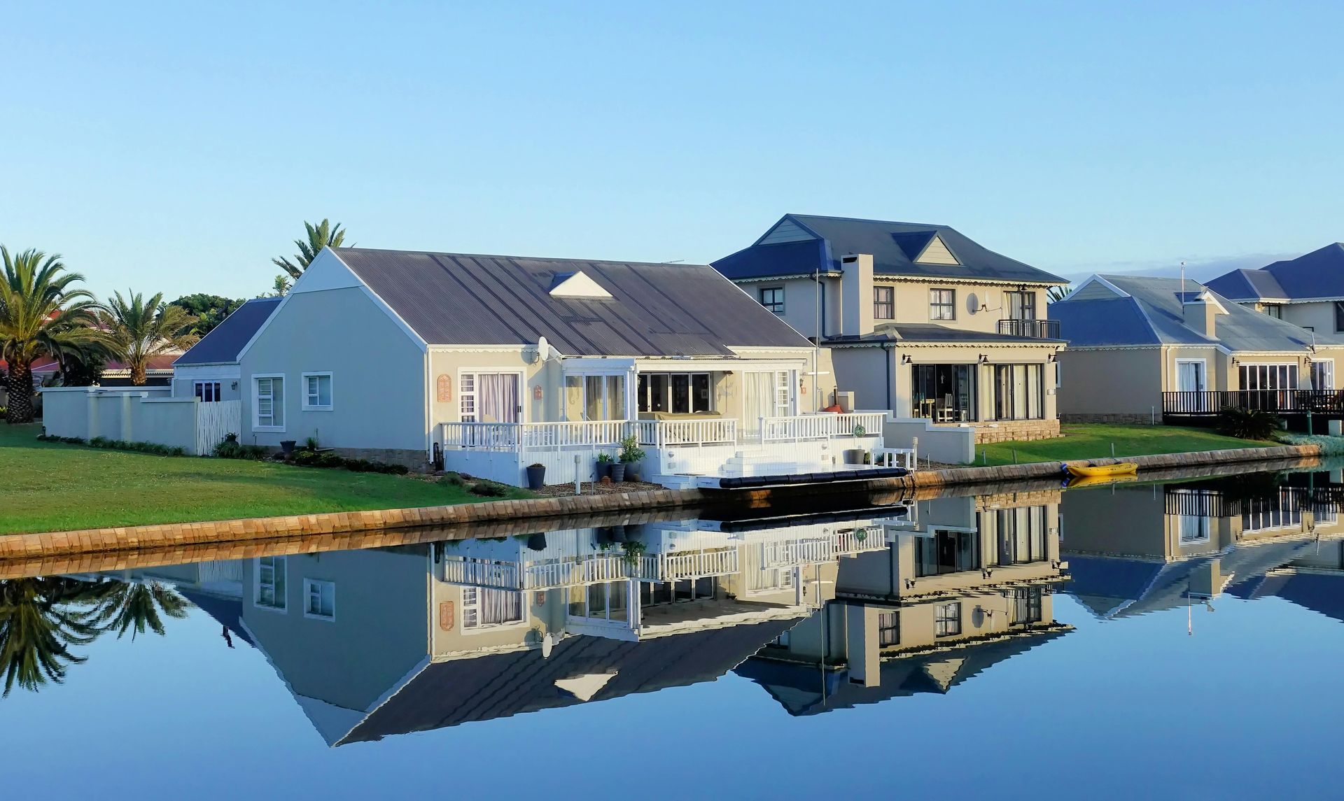 A row of houses sitting next to a body of water