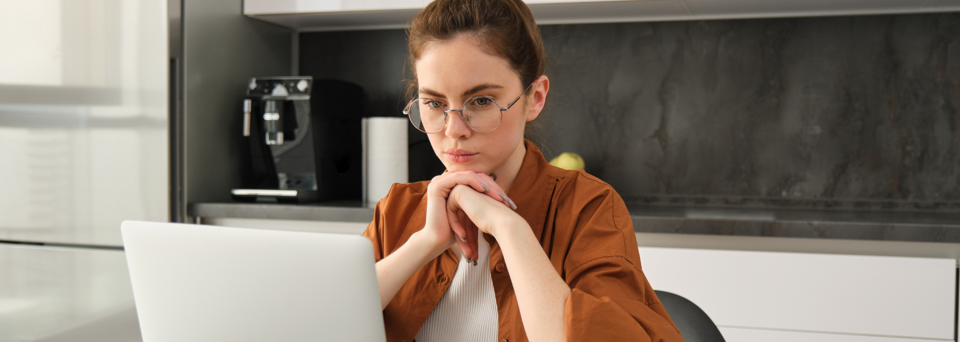 Picture of someone looking pensive at a computer. Picture of someone looking pensive at a computer.