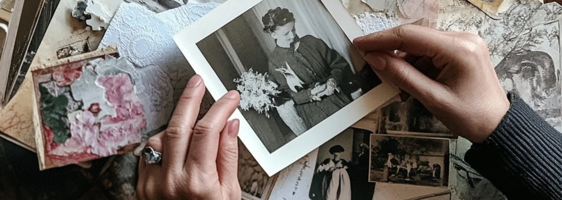 Picture of someone thoughtfully looking through a loved one's possessions.