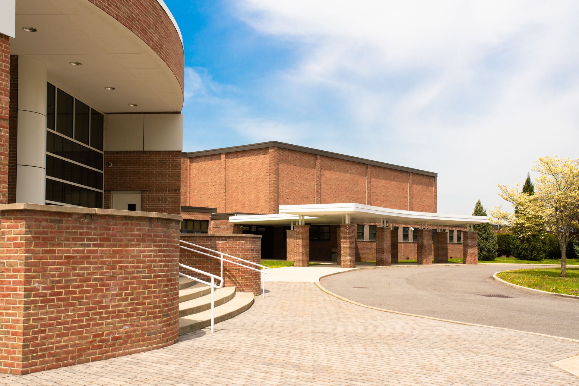 A large brick building with stairs leading up to it