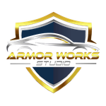 Shield logo with gold trim, a stylized silver car, and text "ARMOR WORKS STUDIO."