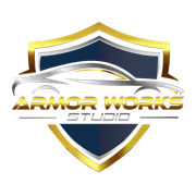 Shield logo with gold trim, a stylized silver car, and text "ARMOR WORKS STUDIO."