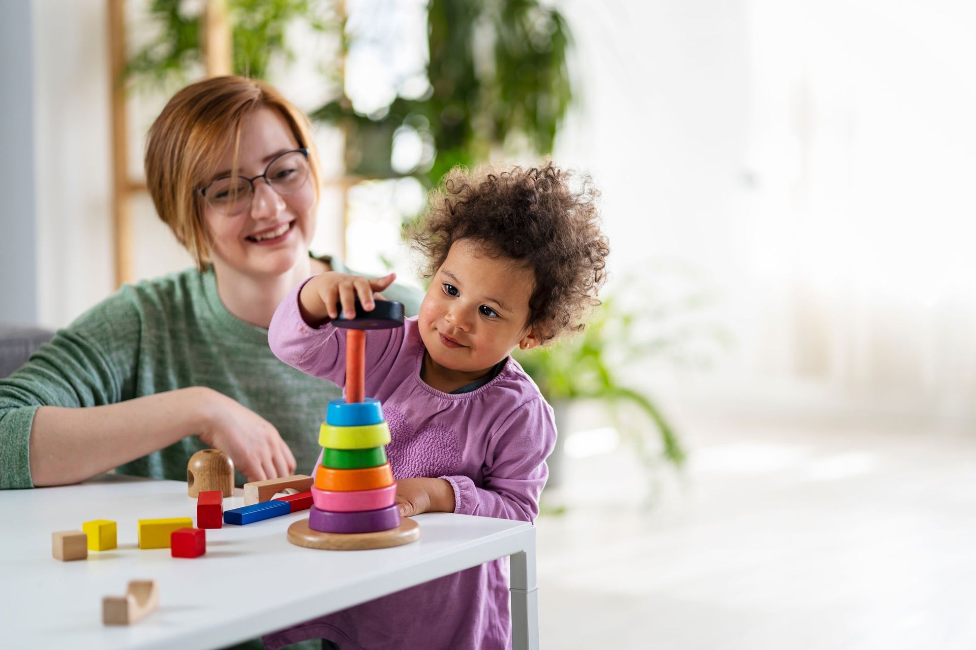 Mother Looking at a Child Playing — Kempsey, NSW — Kempsey Family Day Care