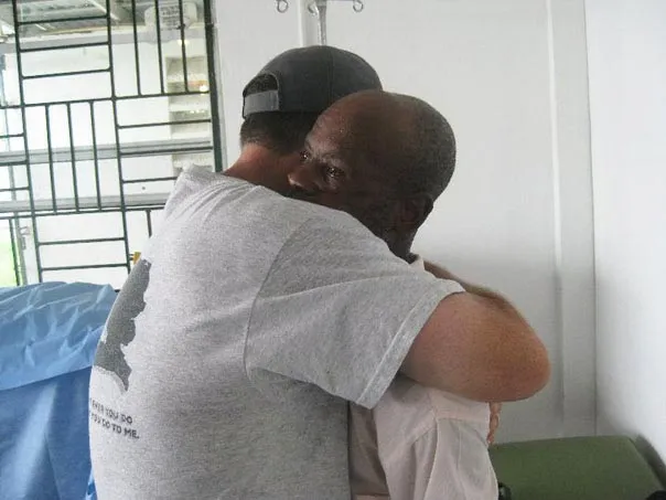 Man Hugging Another Man — Pembroke Pines, FL — Huse Artificial Limb & Brace