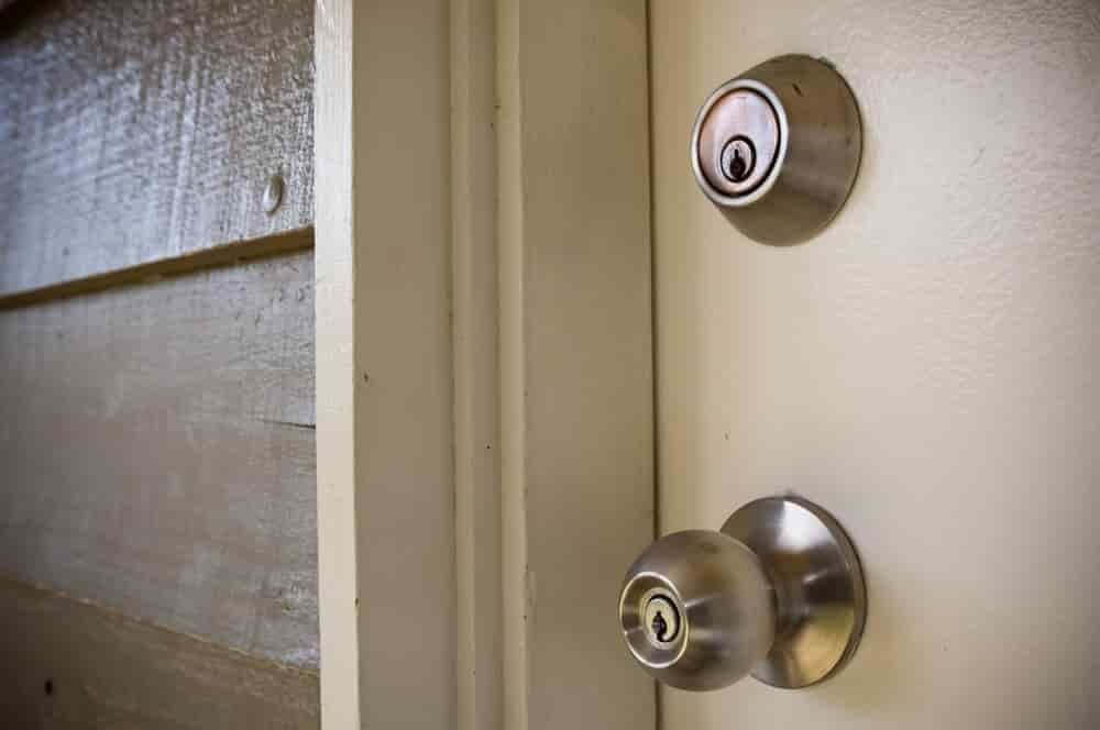A Close up Of a Door Knob on A White Door — East Coast Locksmiths in Kew, NSW