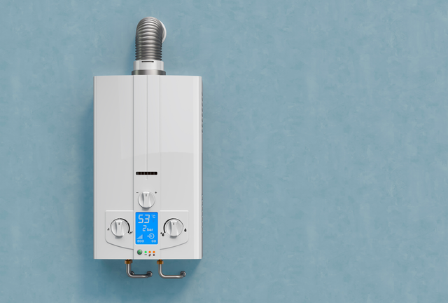 White wall-mounted heater with silver vent pipe against a blue background