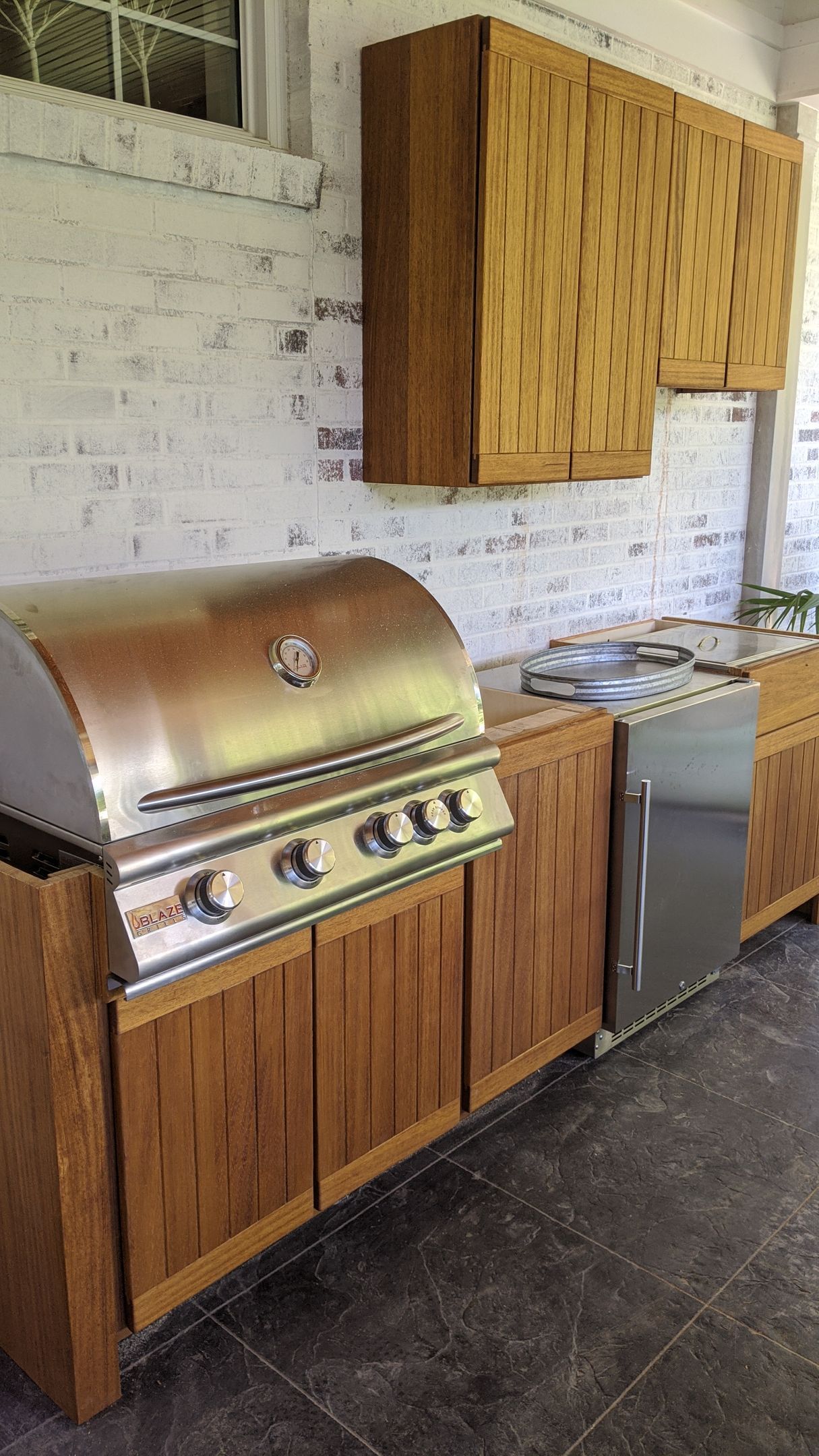 Custom cabinetry around a grill in Mid- Missouri.