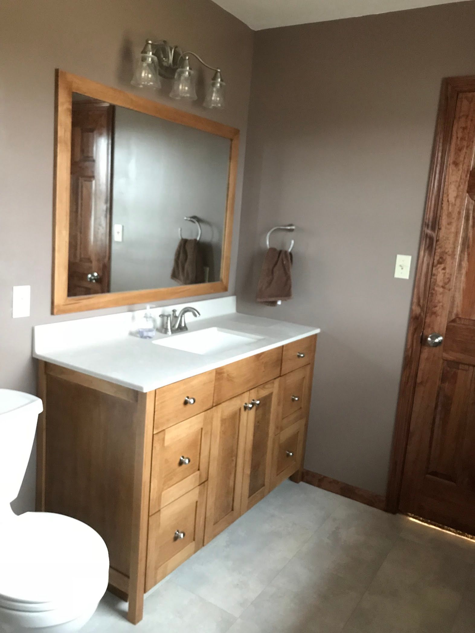 Custom bathroom with custom cabinets and mirror. Mid Missouri