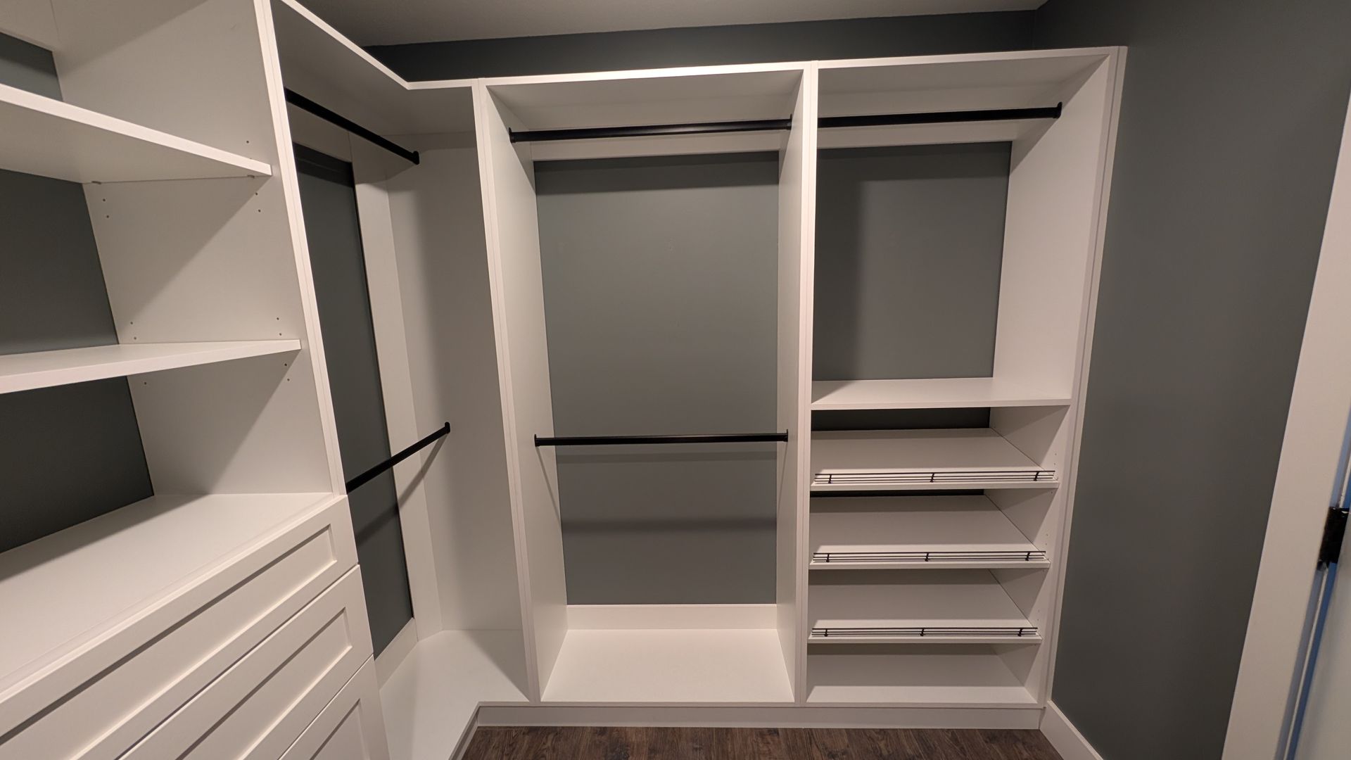 A custom walk in closet with lots of shelves and drawers in Fulton, MO. 