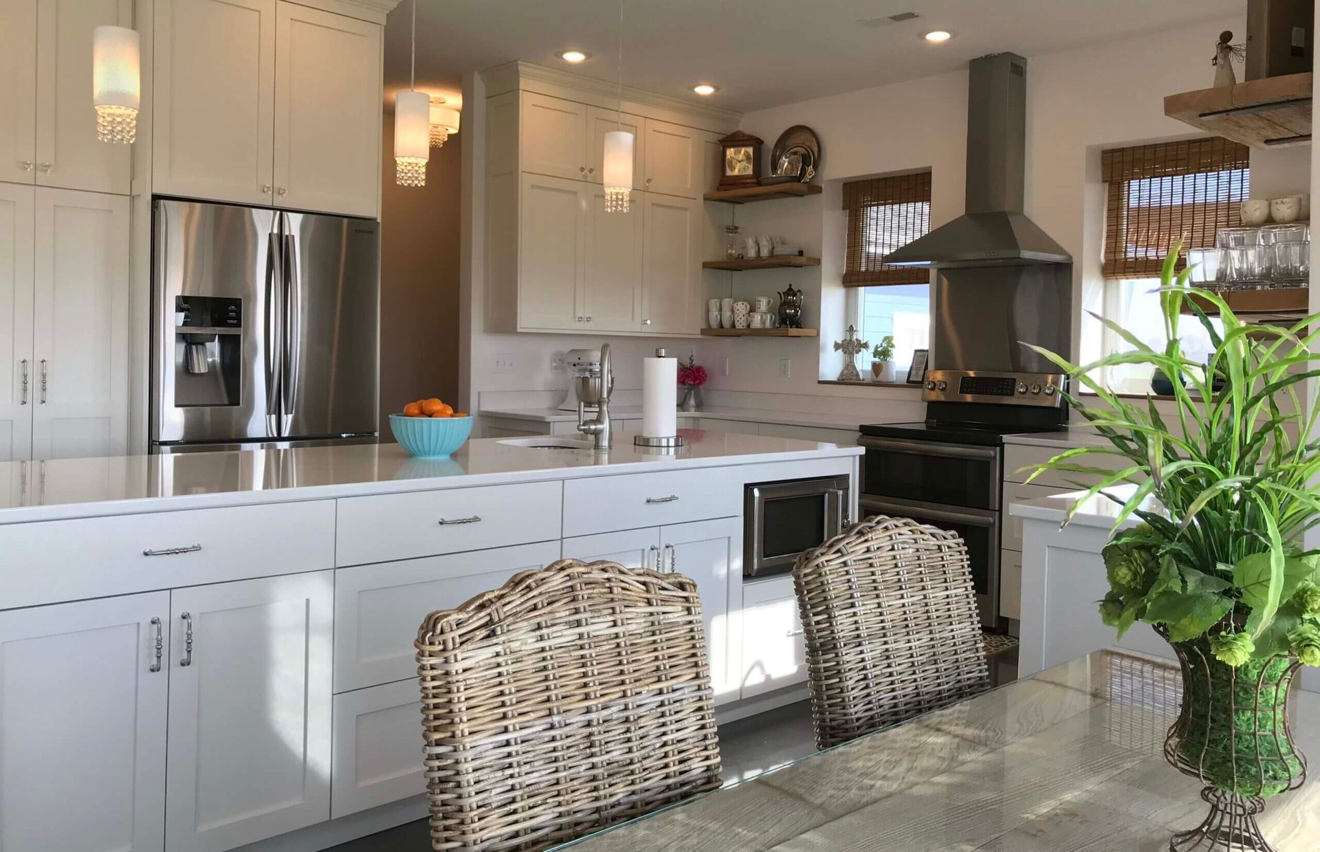 A kitchen with white cabinets and stainless steel appliances. Custom cabinets Columbia Missouri 