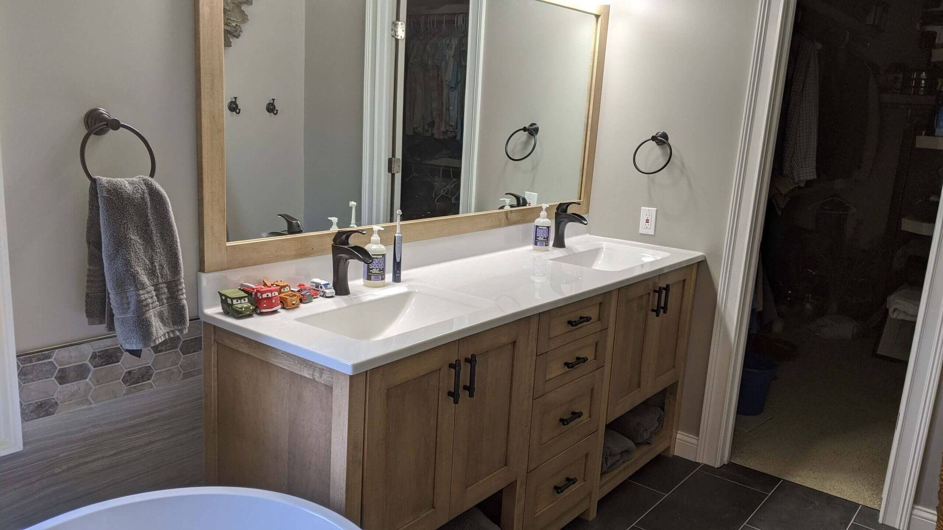 A custom vanity with two sinks and two mirrors in Fulton, Missouri.