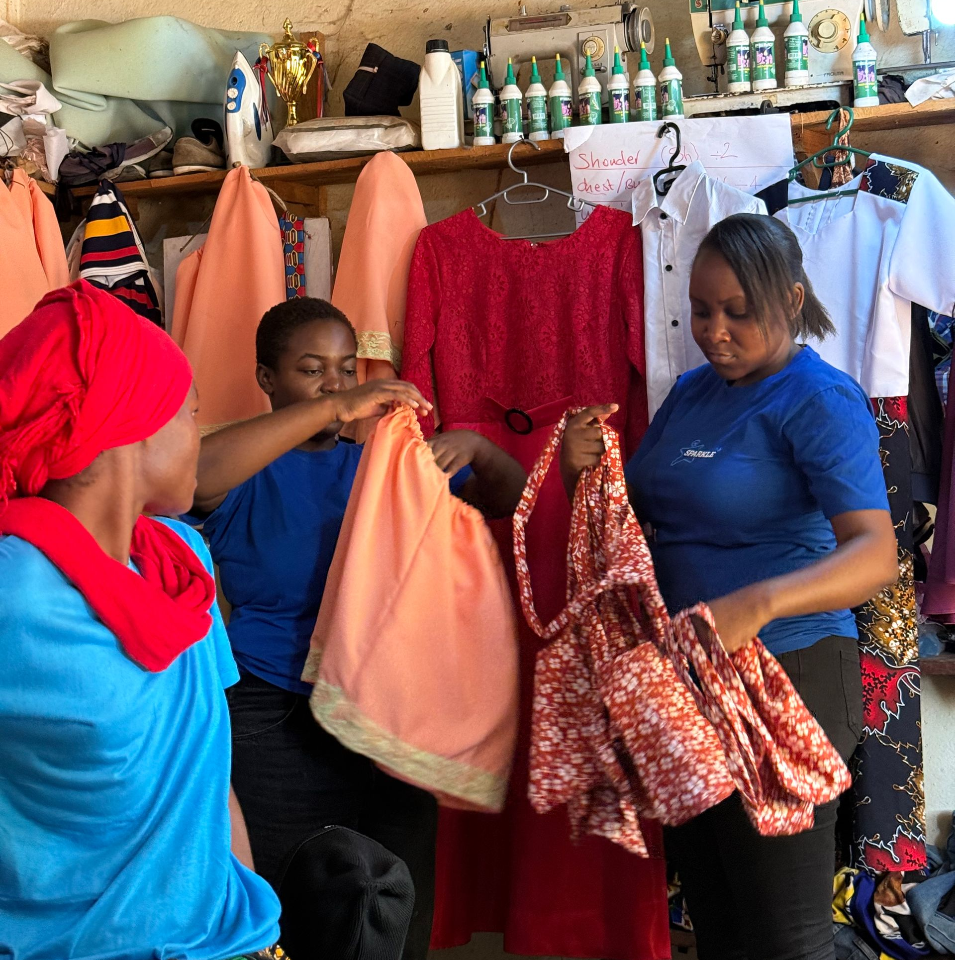 Members of The Sparkle Foundation team review and admire garments produced by tailoring trainees during a monitoring visit at the Spark to Success training centre. provided an opportunity to assess participants' progress, celebrate their achievements, and gather feedback as part of the programme's ongoing commitment