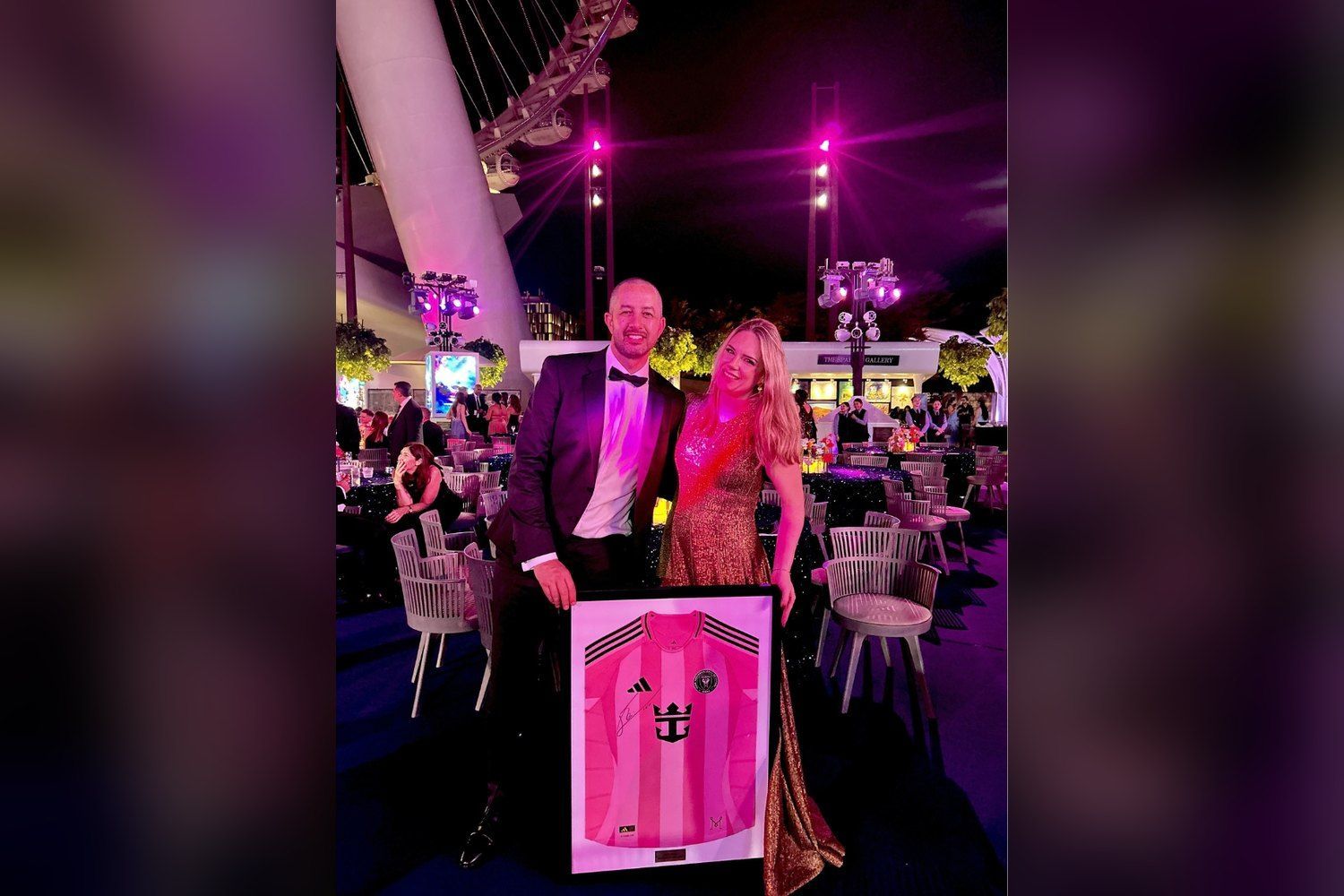 Auction winners with a signed, framed jersey