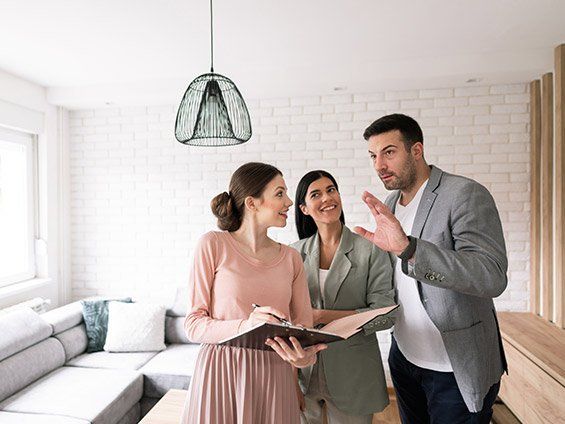 Young Couple And Real Estate Agent — Nutley, NJ — Olde School Title Services, LLC Young Couple And Real Estate Agent — Nutley, NJ — Olde School Title Services, LLC