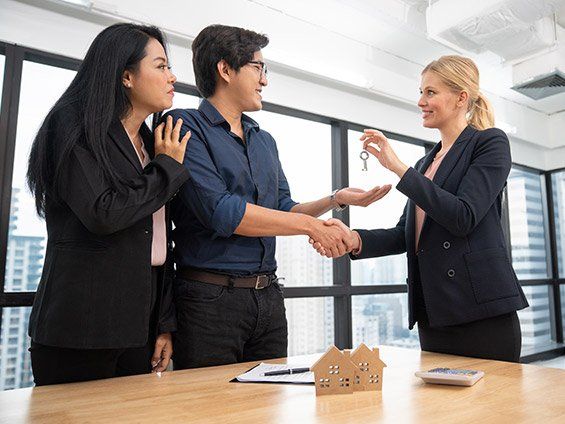 Woman And Man Shaking Hands — Nutley, NJ — Olde School Title Services, LLC Woman And Man Shaking Hands — Nutley, NJ — Olde School Title Services, LLC