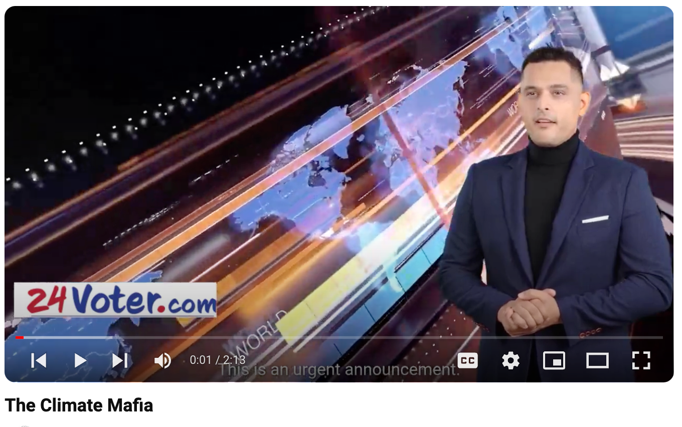 News anchor in dark suit before a colorful 24Voter.com broadcast graphic.
