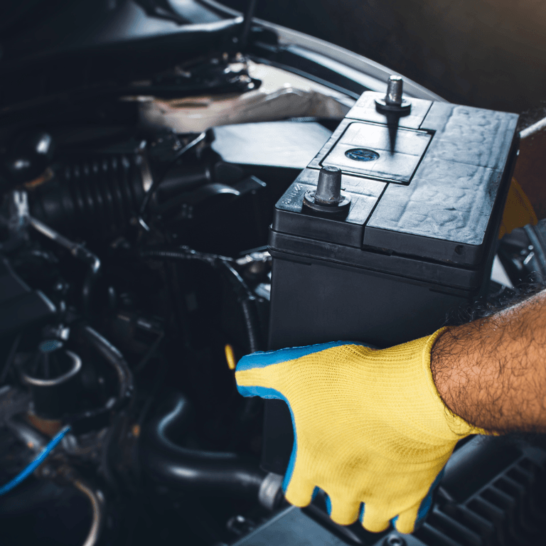 diagnostic scanning tool held by a mechanic