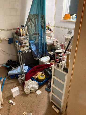 Image showing another view of the bathroom full of items. Another view of the bathroom full of items.
