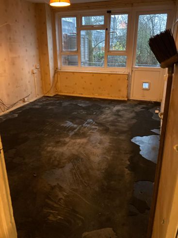 Image of room after all items have been removed except for the carpet Room after Terry's house clearance have removed all items