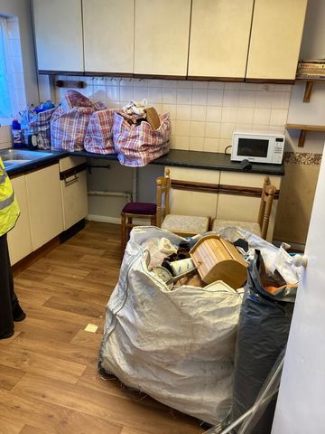 Image showing kitchen with everything bagged up ready to go Kitchen inside a property. Terry's house clearance have bagged everything up ready to go