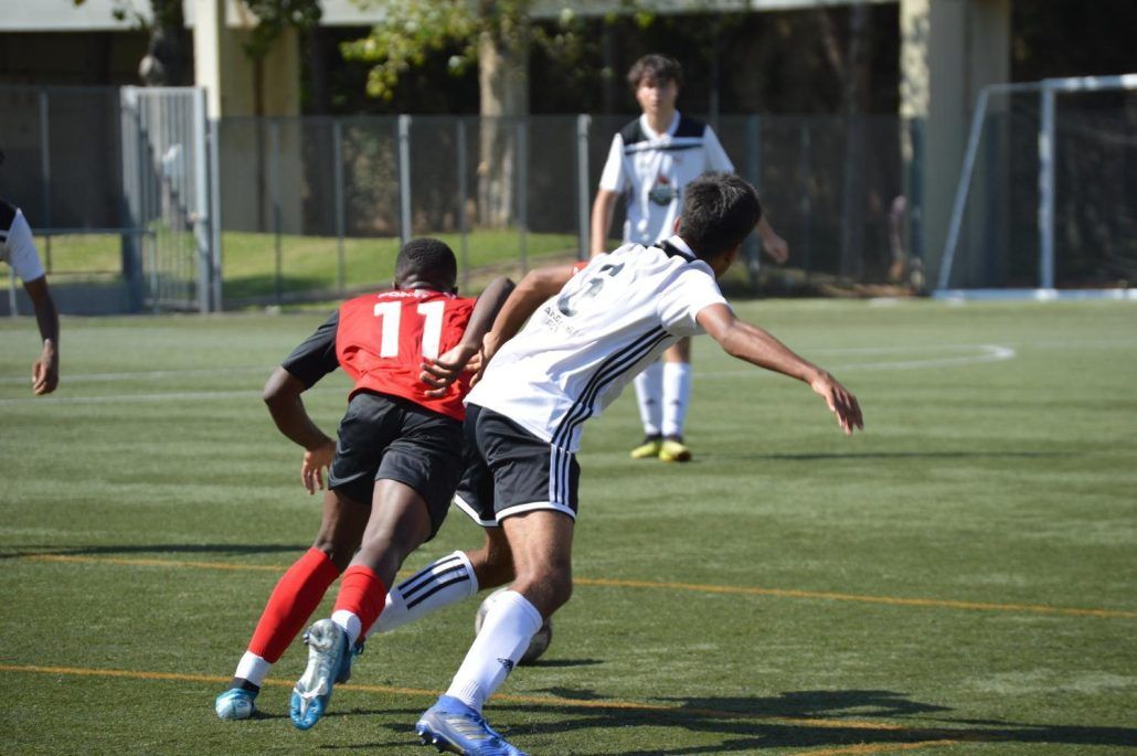 A soccer player with the number 11 on his jersey