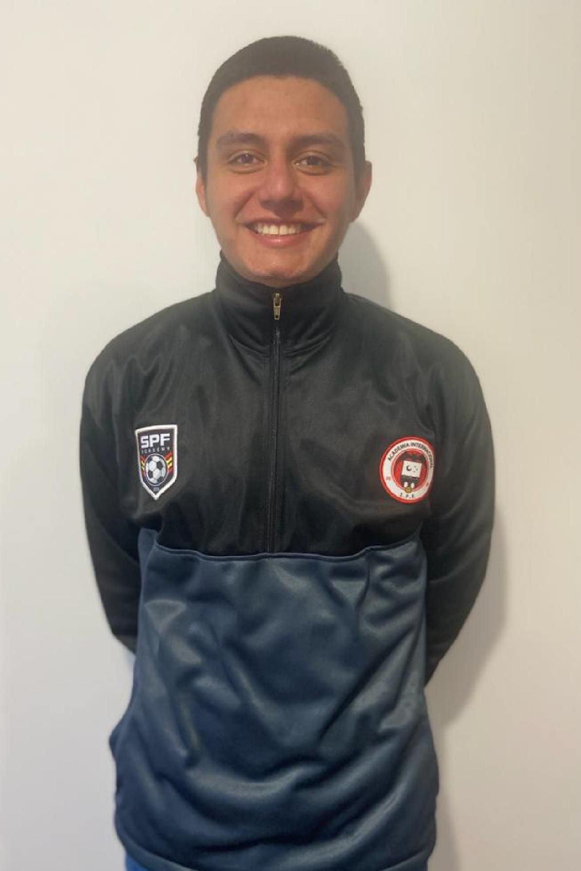 Daniel Felipe Lopez wearing a black jacket with the letter b on it