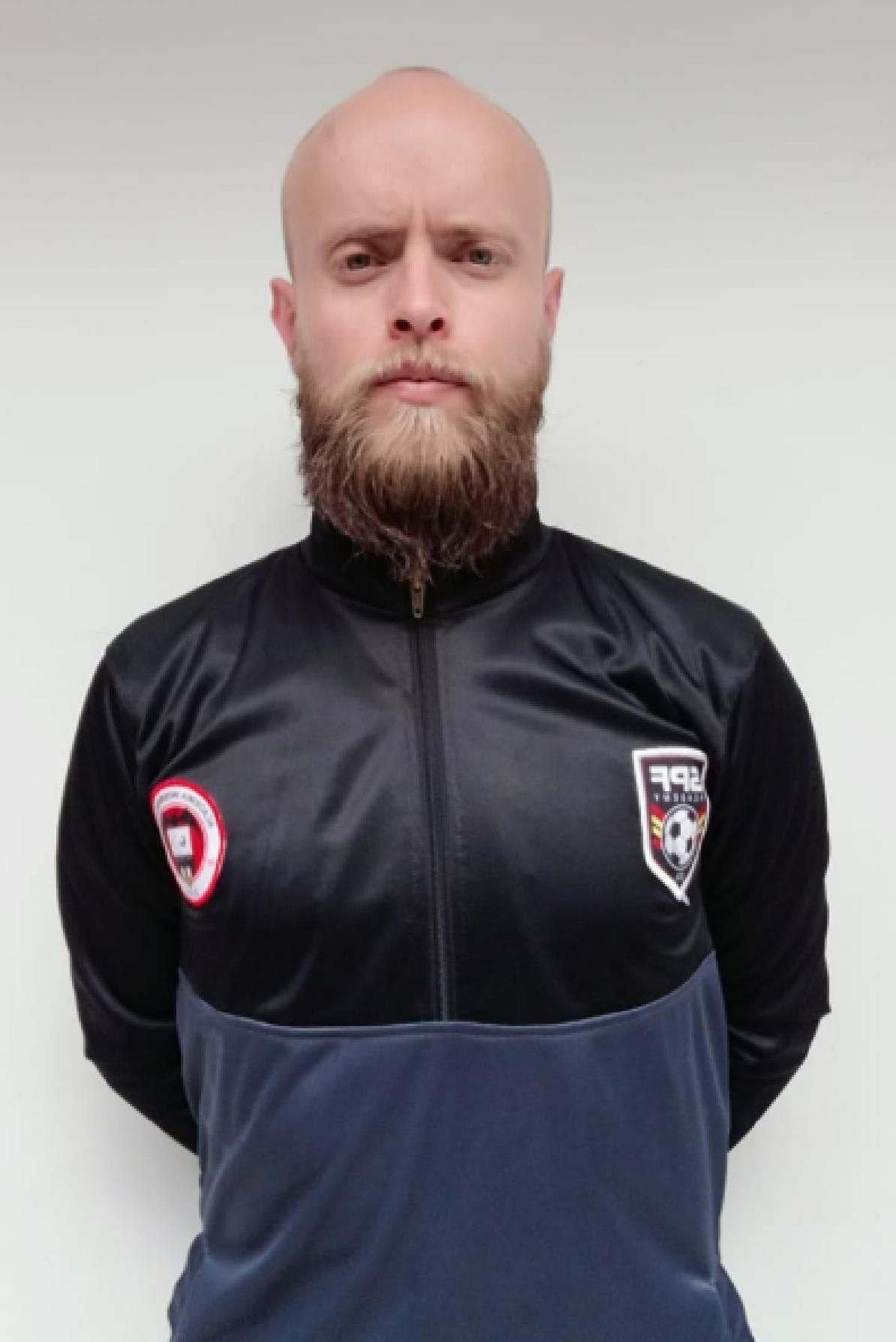 Yeisson Contreras with a beard is wearing a black jacket
