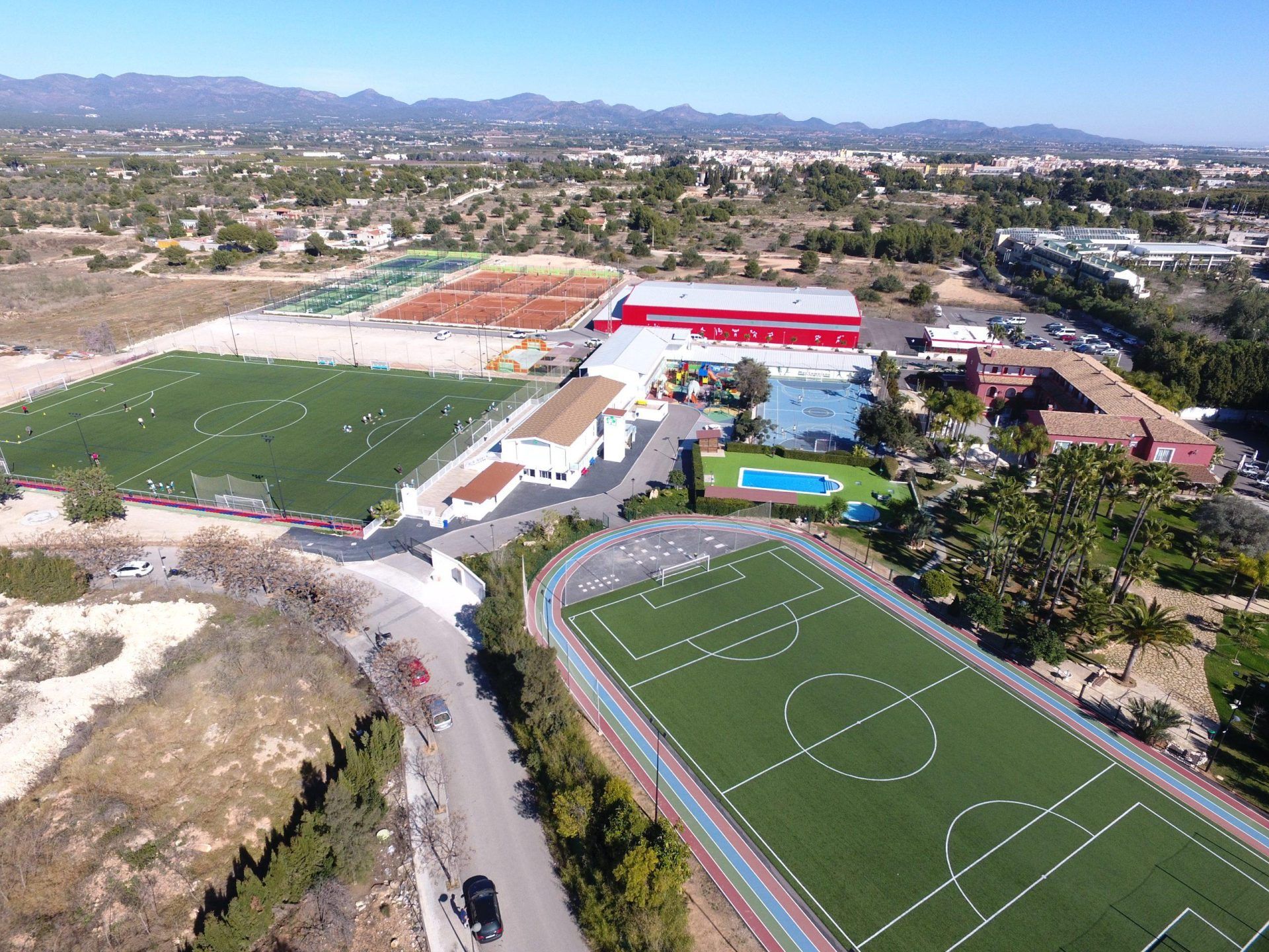 An aerial view of a soccer field and a track.