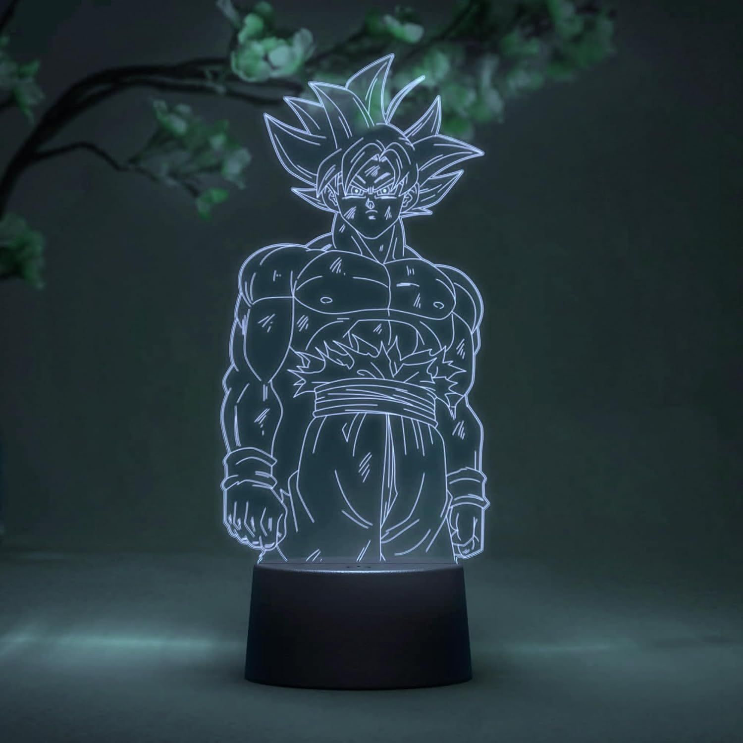 Una lámpara de ilusión 3D de Goku de Dragon Ball Z brilla en la oscuridad.