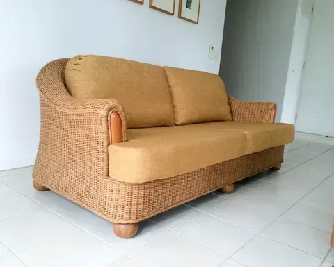 A Wicker Couch is on a Tiled Floor in a Living Room — Paulie's Upholstery in Edmonton, QLD