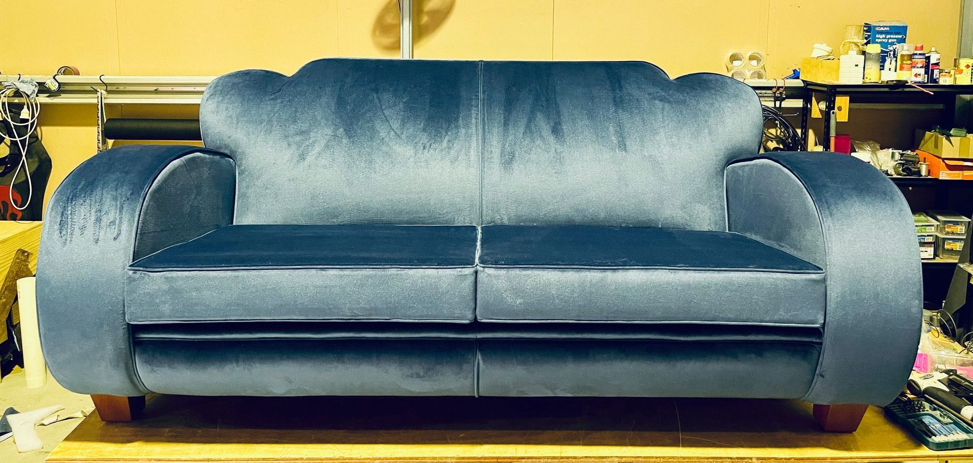 A Blue Couch Is on a Tiled Floor — Paulie's Upholstery in Edmonton, QLD