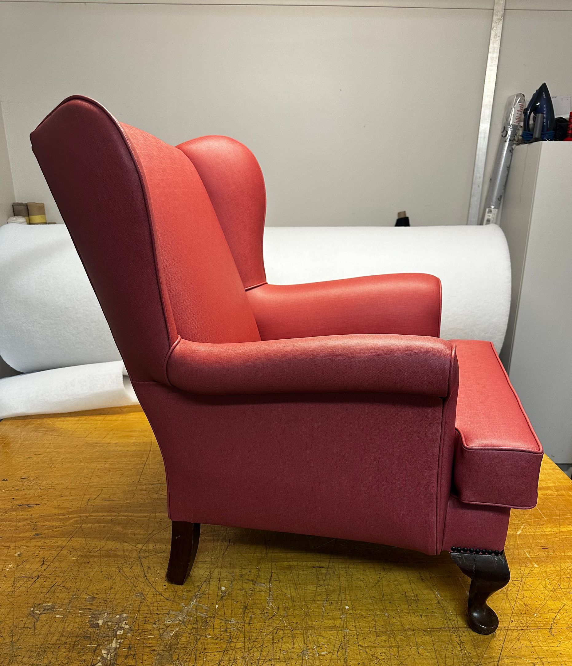 A Red Couch Chair Facing The Side — Paulie's Upholstery in Edmonton, QLD