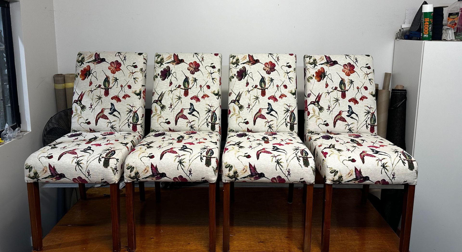 4 White Chairs With Patterns Next To Each Other — Paulie's Upholstery in Edmonton, QLD