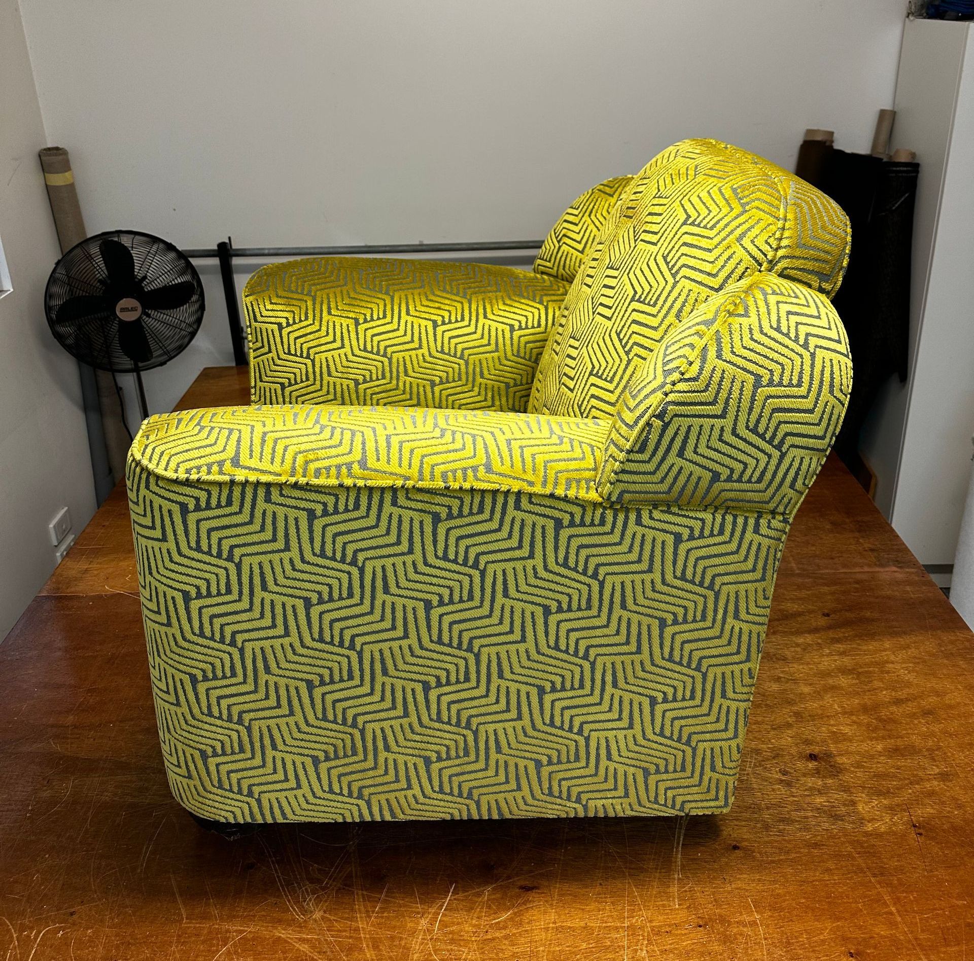 A Green Couch Chair Facing The Side — Paulie's Upholstery in Edmonton, QLD