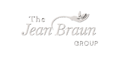 The logo for The Jean Braun Group features teal text with an icon of a hand holding two small leaves above the text.