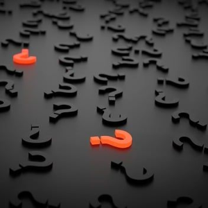 Many black question marks scattered on a grey surface, with three highlighted in orange.