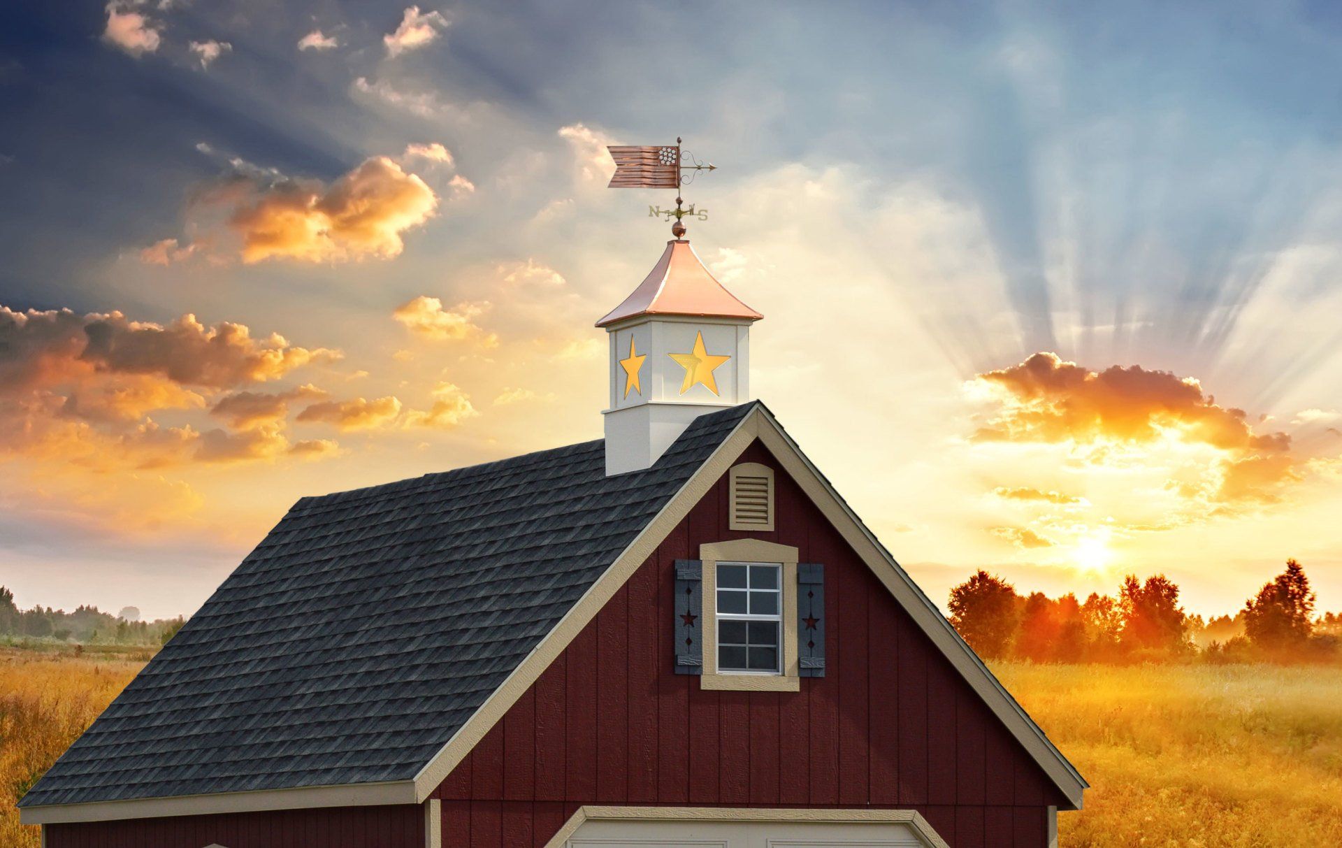 Red barn sunrise a red barn with a weather vane and cupla on top of it