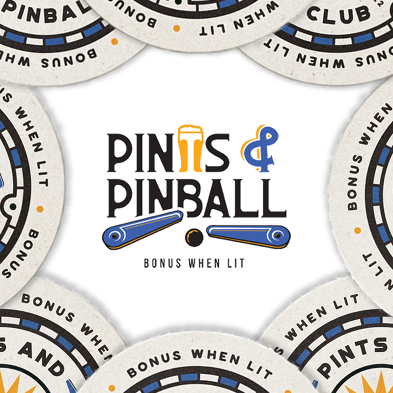 Pins and Pinball logo centered on white, with pinball chips around the edges and “BONUS WHEN LIT” text