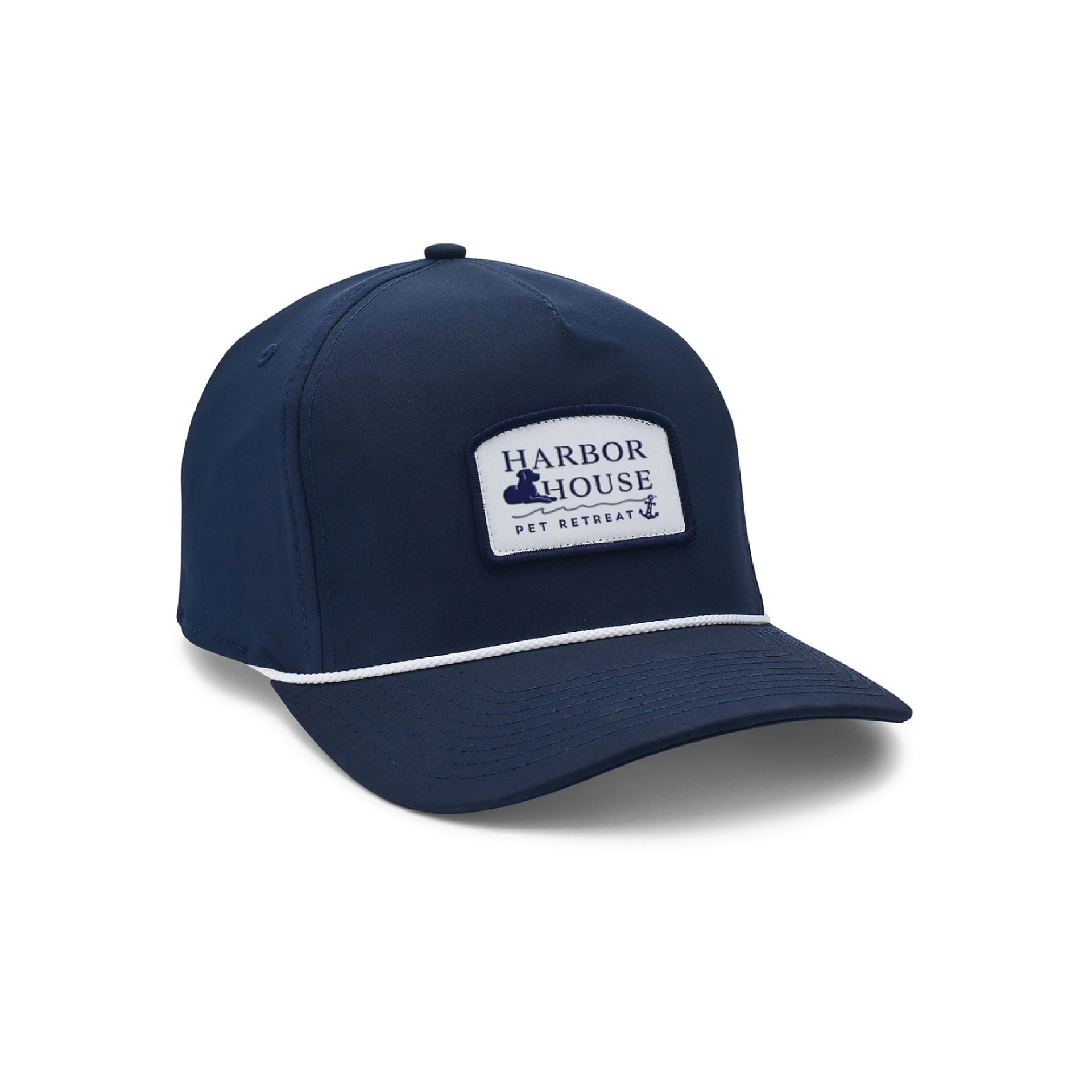 Navy blue baseball cap with a white logo patch and curved brim on a white background