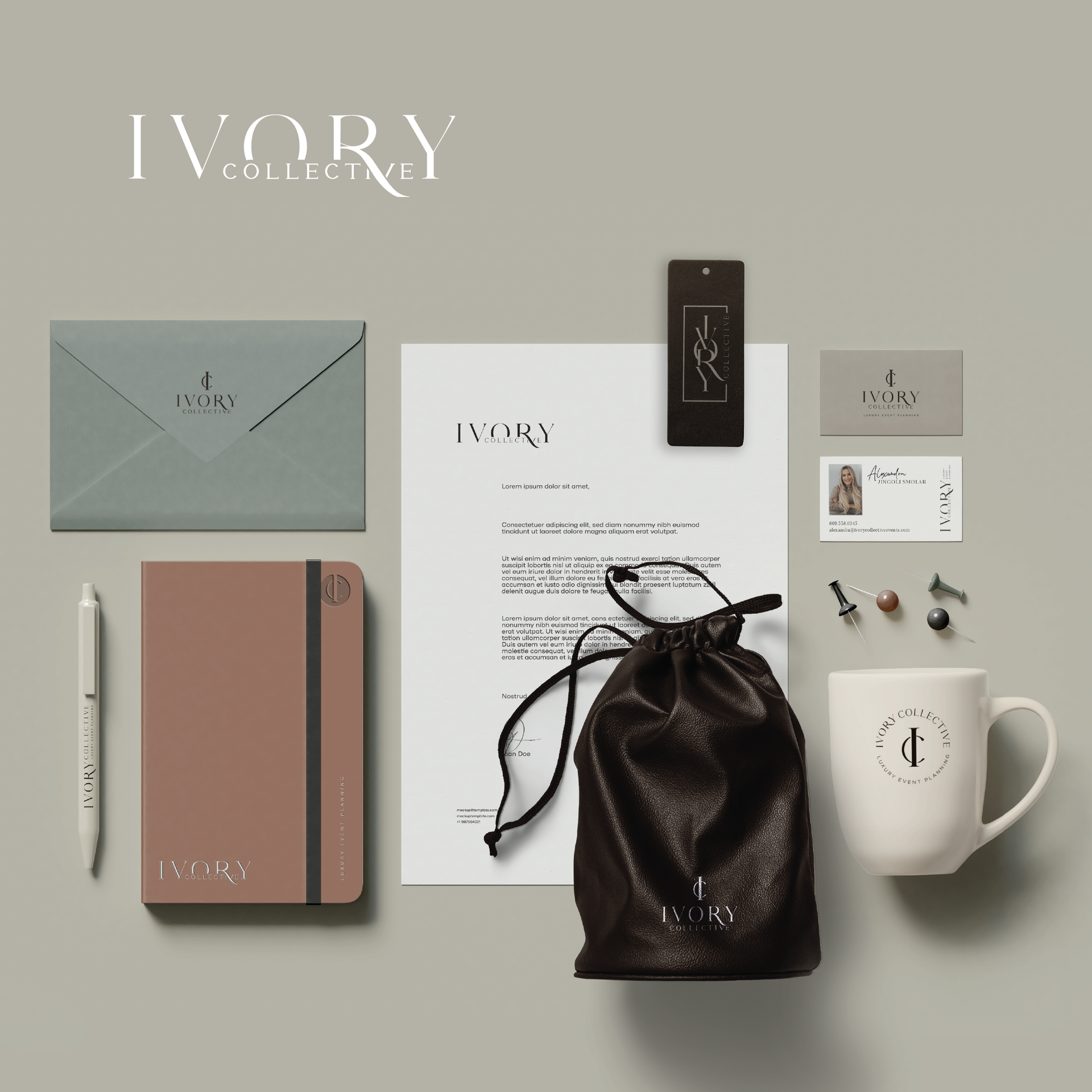 Flat lay of ivory stationery, notebook, mug, pouch, and accessories on a beige background