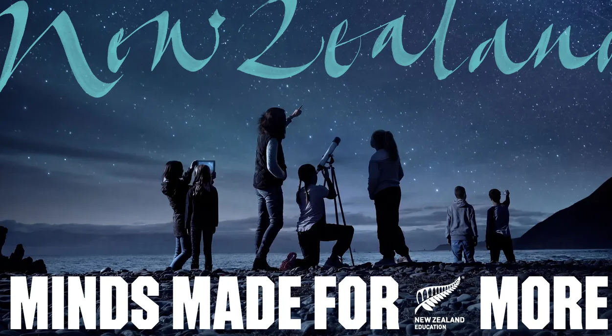 Silhouetted hikers under a starry blue sky with the words “MINDS MADE FOR MORE” across the bottom.