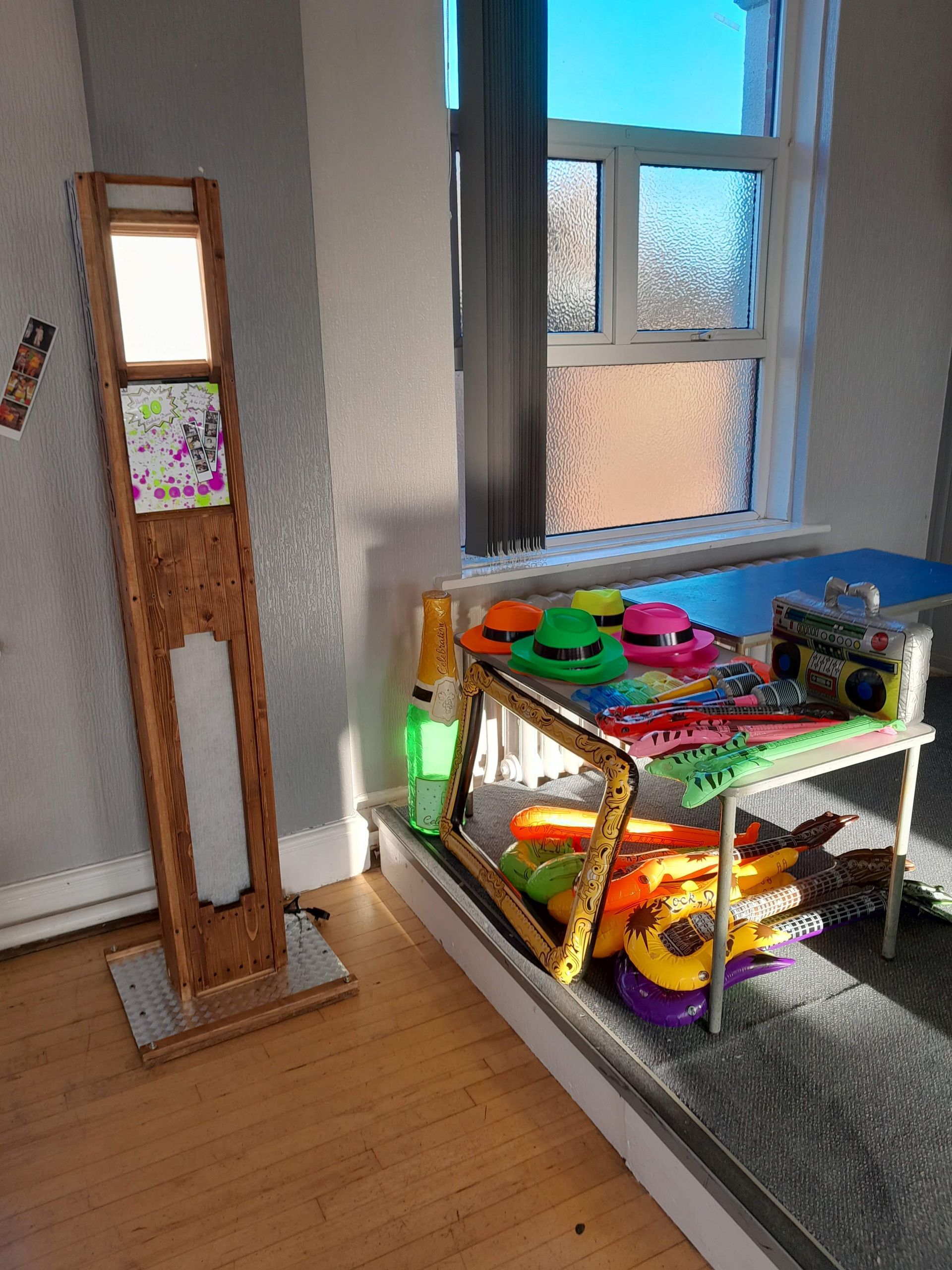 Selfie pod and props table at a 30th birthday party.