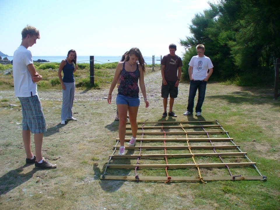 A group partaking in a minefield team challenge game.
