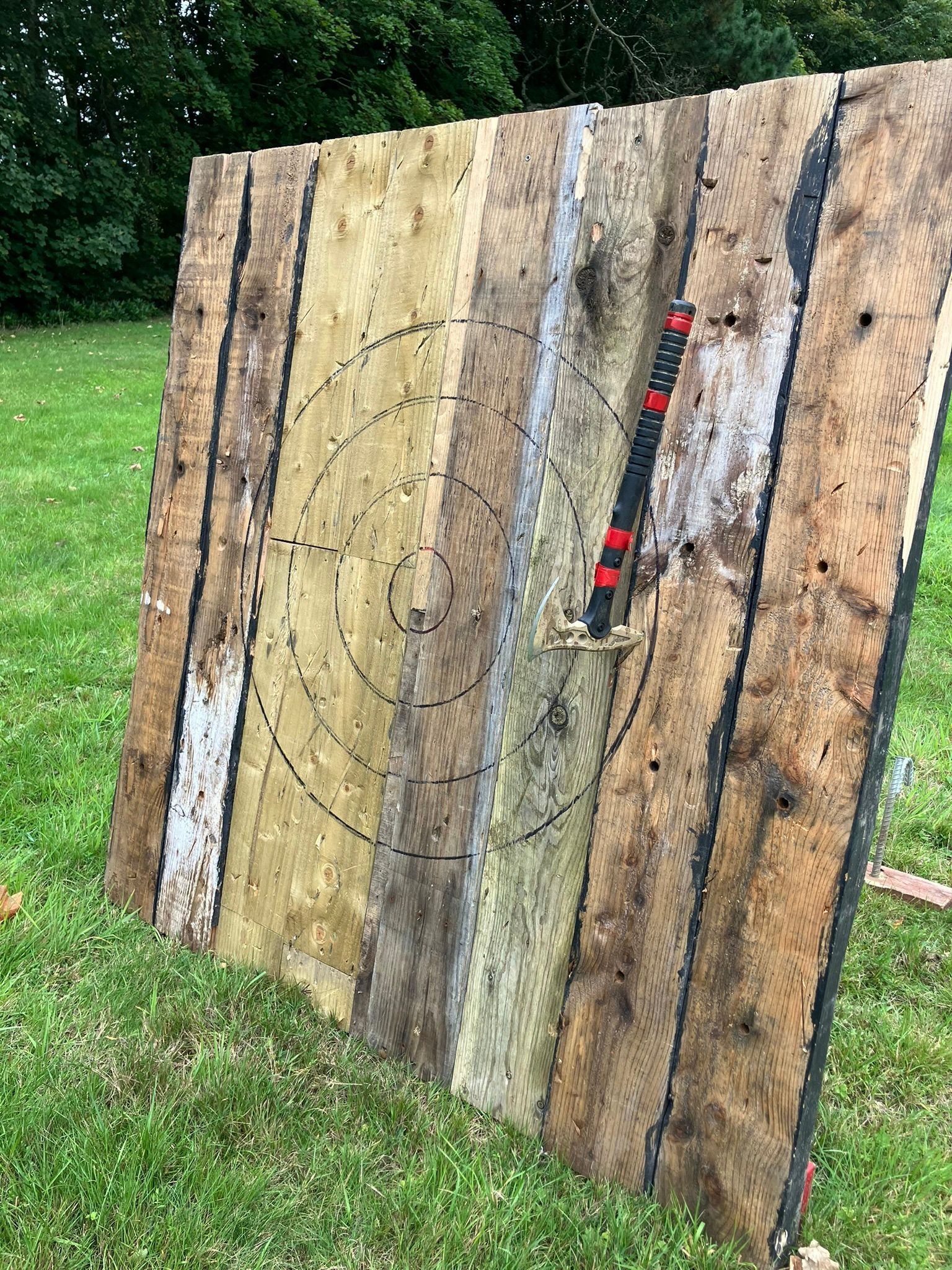 Archery tag set up indoors in a sports hall.  Blow up bunkers.