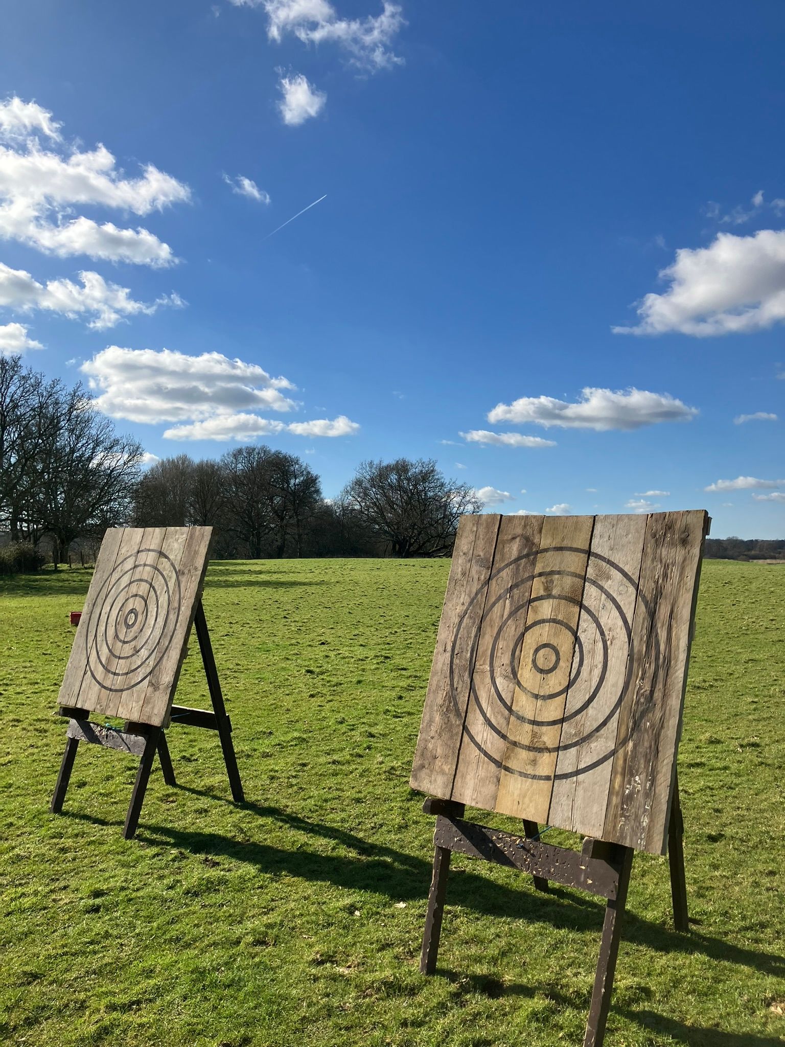 2 axe throwing targets set up at House on the Brooks in Pulborough next to a flooded lake.