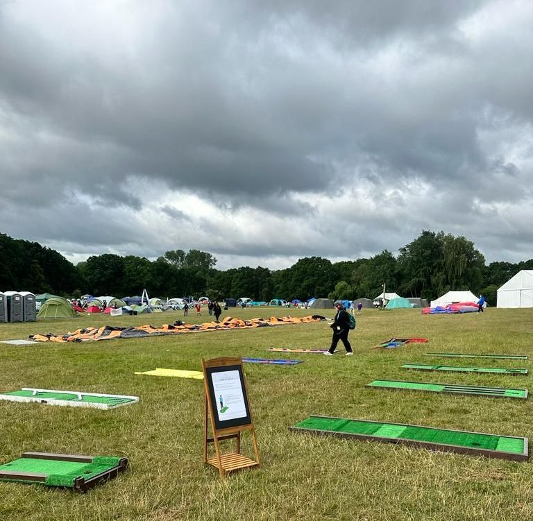 9 holes of crazy golf on a field