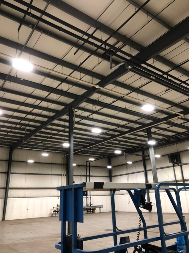 Electrician servicing a commercial building electrical panel