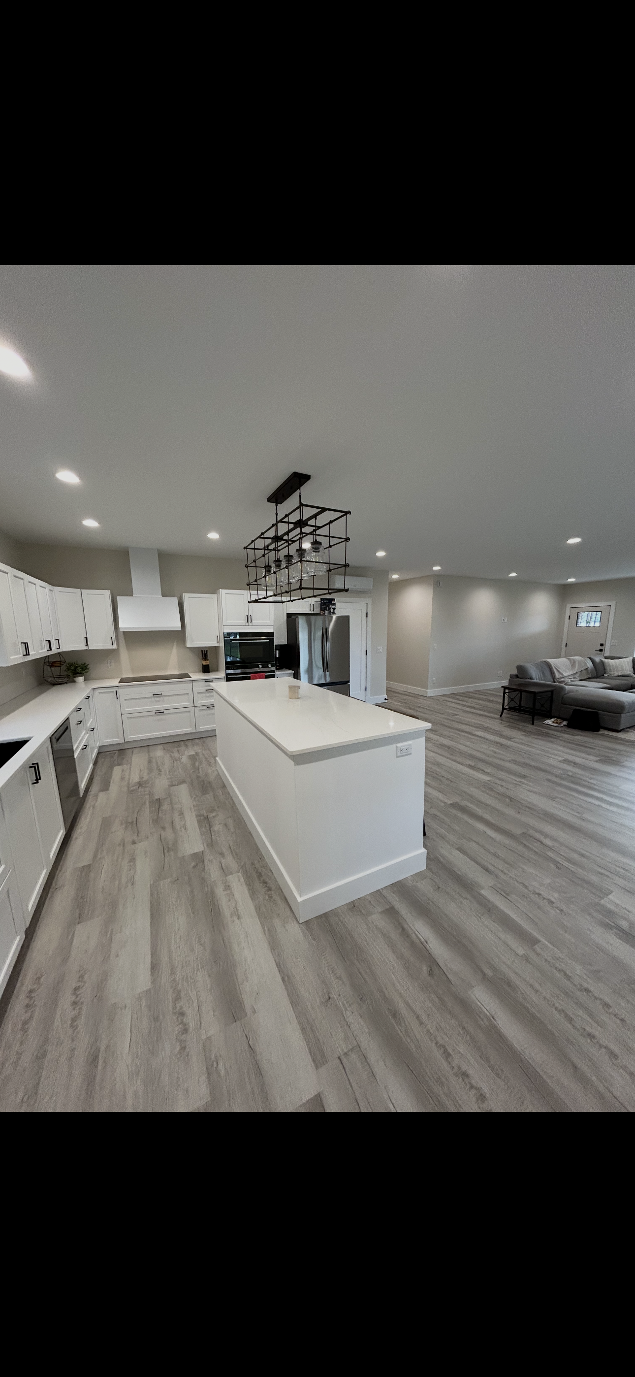 Modern living room ceiling featuring neatly installed LED recessed lighting.