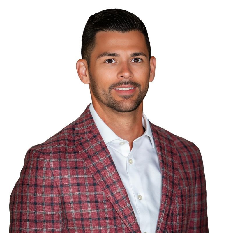 Portrait of a smiling man in a red plaid blazer and white shirt on a white background