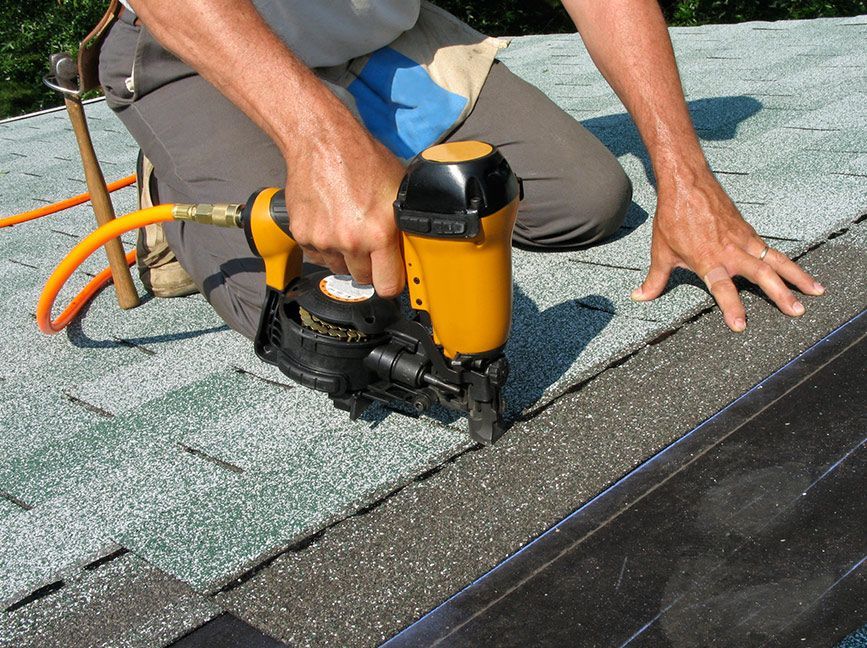 Roof repair in Richmond Hill GA fixing lifted shingles after a storm on a residential home